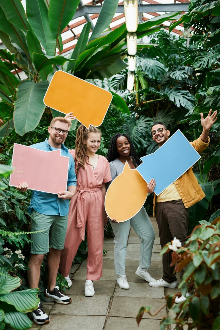 Photo of Men and Women Holding Blank Signboards